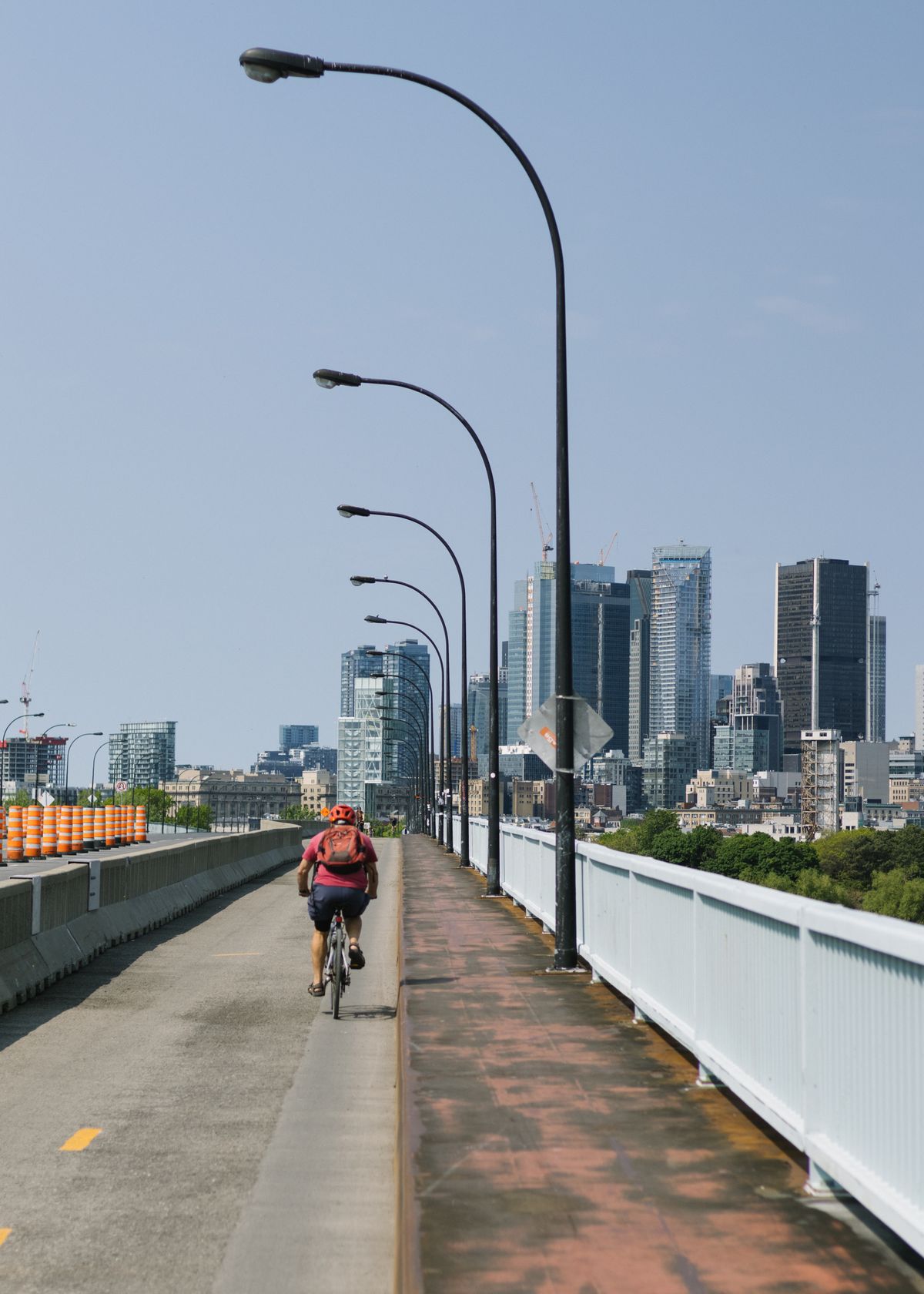 Cyclist riding through a modern urban environment