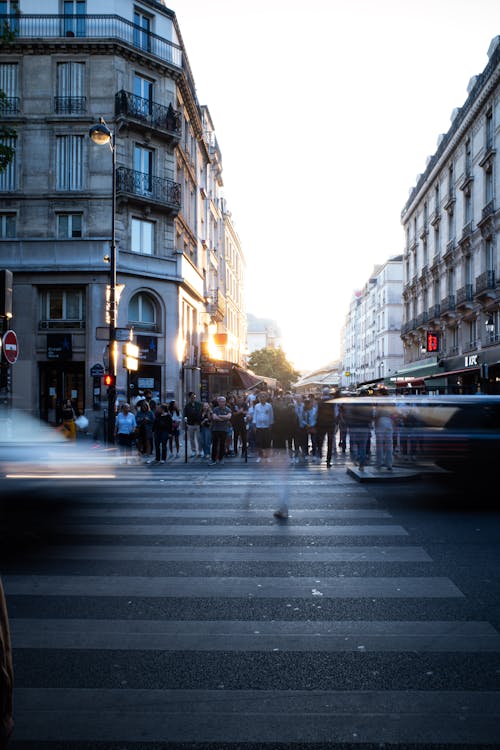 People Waiting on Crossing Zebra