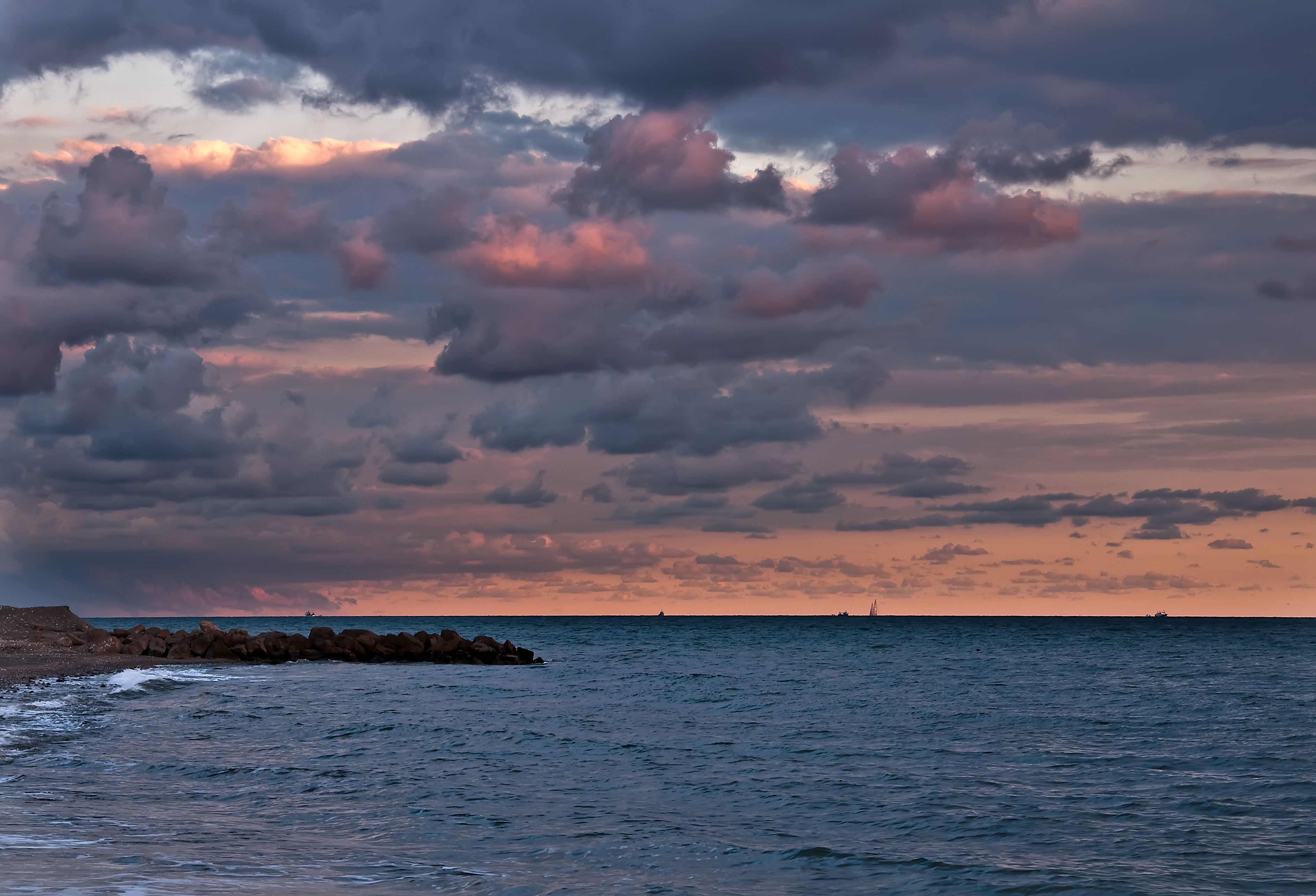 Clouds over Sea Coast at Sunset · Free Stock Photo