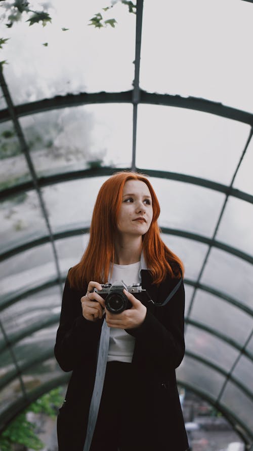 Redhead Woman with Camera