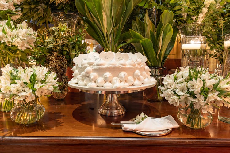 Cake And Flowers On Table