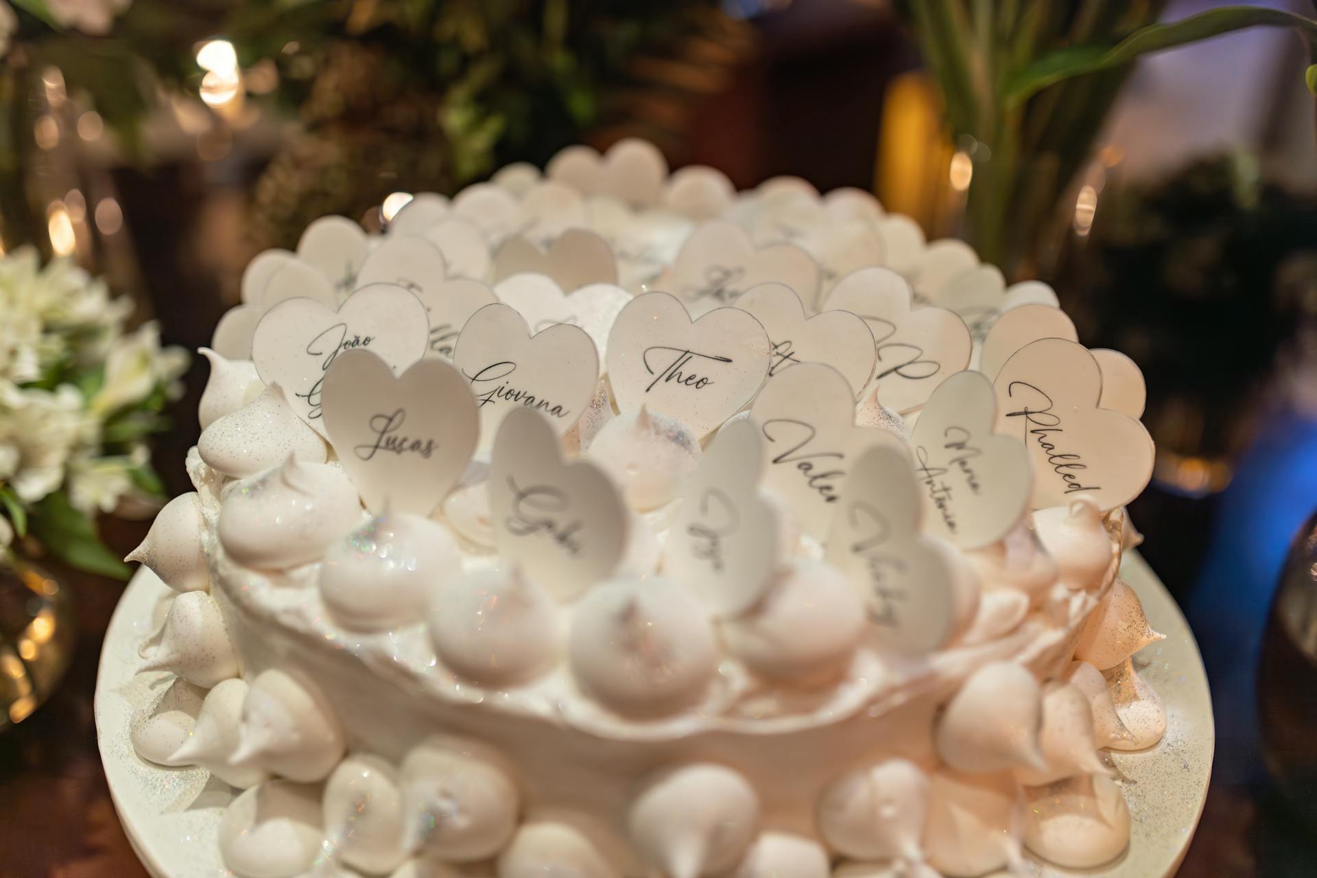 Wooden Hearts with Names Decorating Meringue Cake