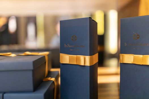 Elegant Perfume Boxes Tied with Yellow Ribbon