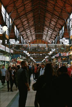 Crowded scene inside Budapest's iconic Central Market Hall, Hungary.