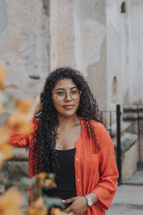 Portrait of Woman with Curly Hair and in Eyeglasses