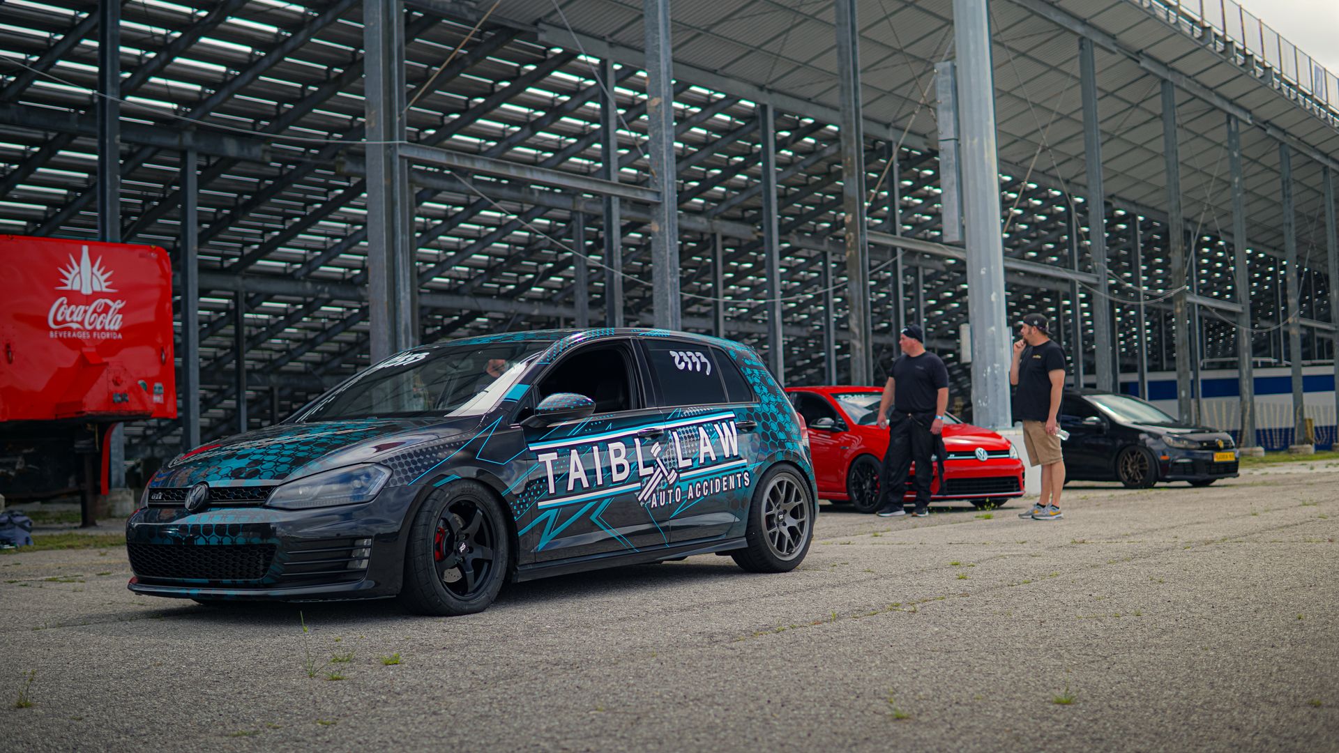 Volkswagen Golf GTI among Cars Parked near Stadium