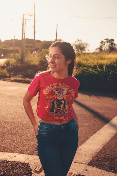 Smiling Woman Posing on Street in Sunlight