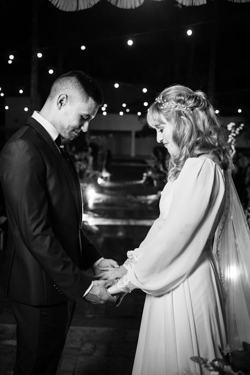 Bride and Groom Holding Hands and Smiling 