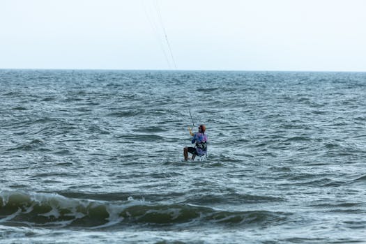 Exciting kiteboarding experience on the vast ocean, capturing the spirit of adventure and water sports.