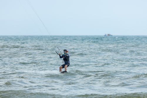 Fotos de stock gratuitas de deporte acuático, horizonte, kiteboarder