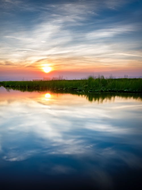 Sunset reflection on still water