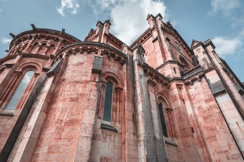 Free Explore the stunning Gothic architecture of Santa María la Real de Covadonga against a bright sky. Stock Photo