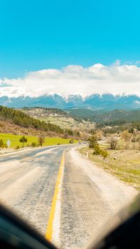 Beautiful road leading to snowcapped mountains near Bursa, Türkiye.