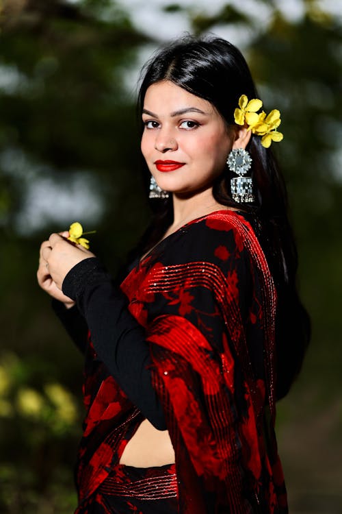 Portrait of Woman with Flowers in Black Hair