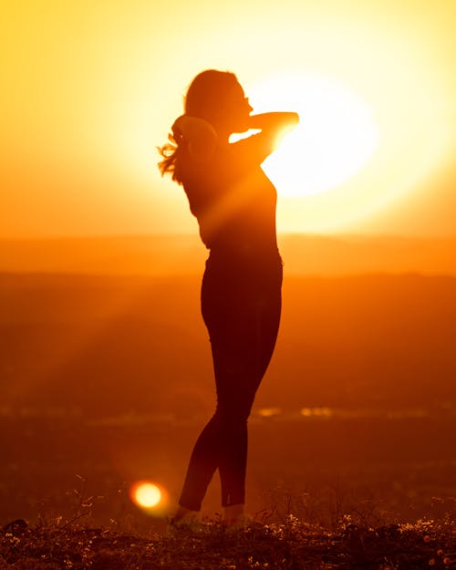 Silhouette of Posing Woman at Sunset
