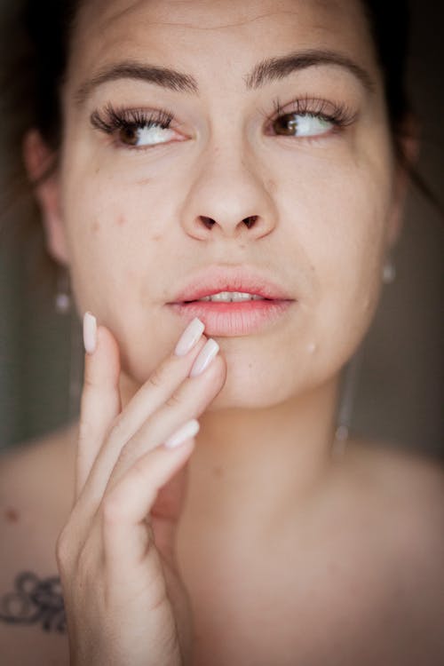 A woman with tattoos on her face