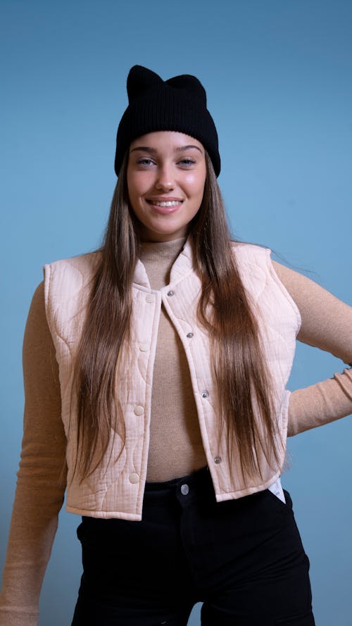 Smiling Woman in Hat and Vest