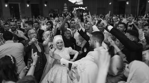 Black and White Photo of People Celebrating a Wedding