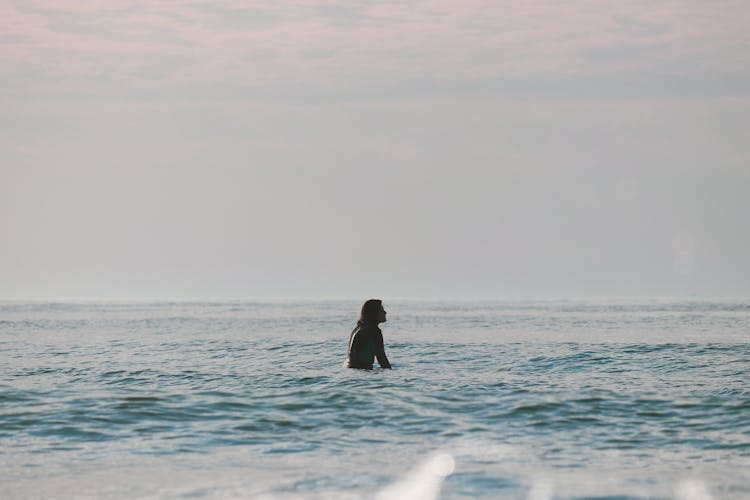 Surfing At Sunrise In Deal Beach, NJ