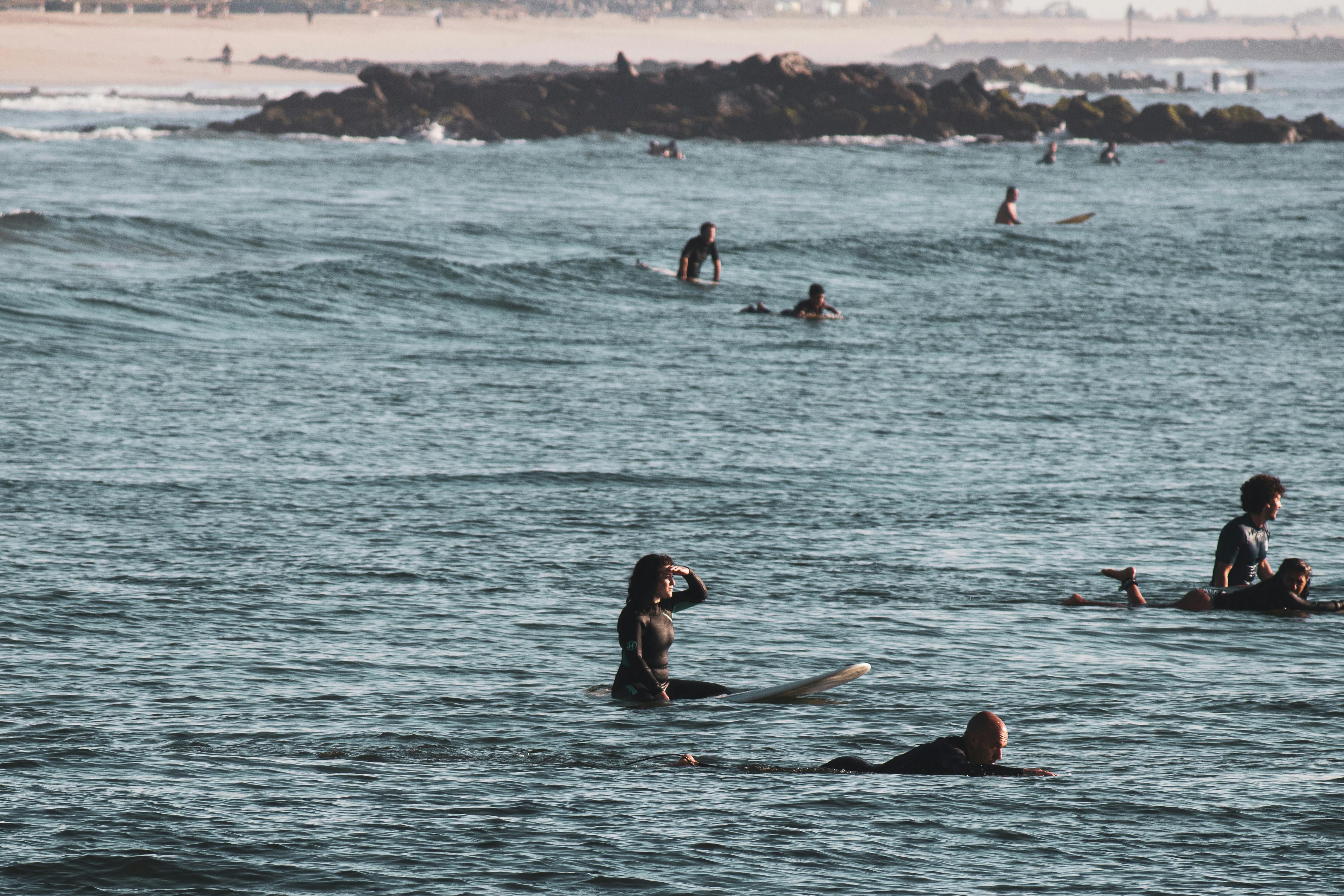 Surfing at Sunrise in Deal Beach, NJ · Free Stock Photo