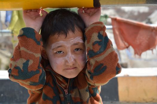Portrait of a Little Boy with Painted Face 