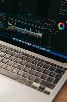 Detailed view of video editing software interface on a MacBook Air.