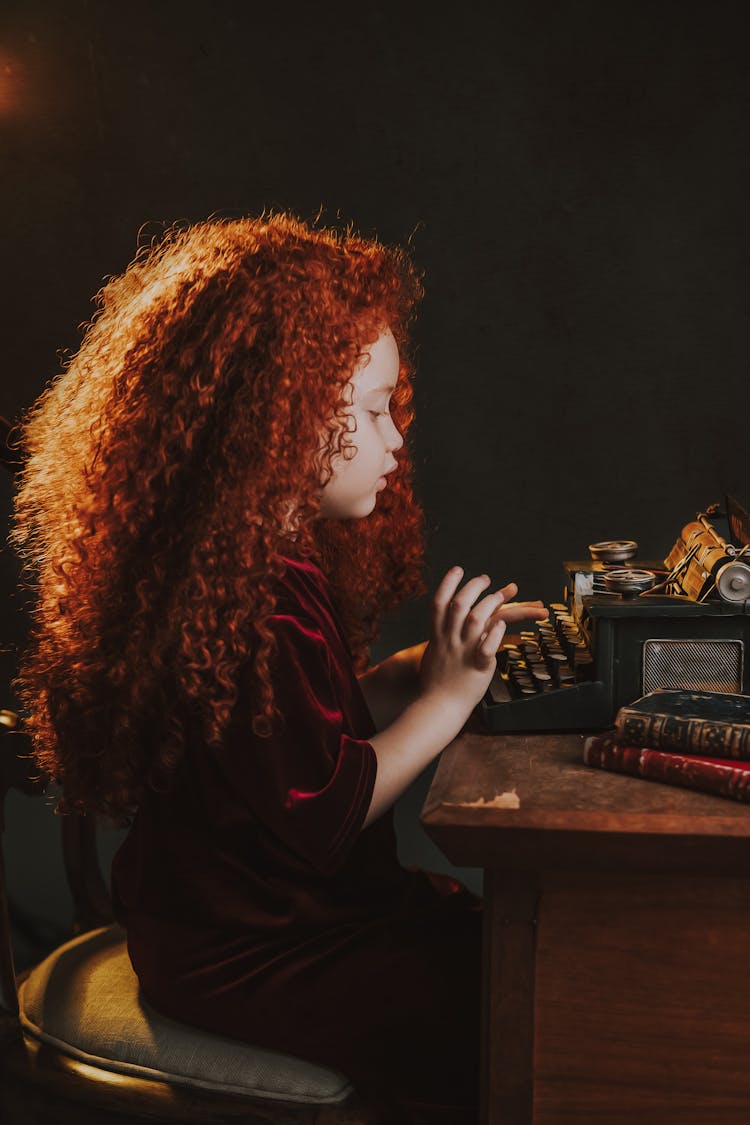 Child Using Vintage Typewriter