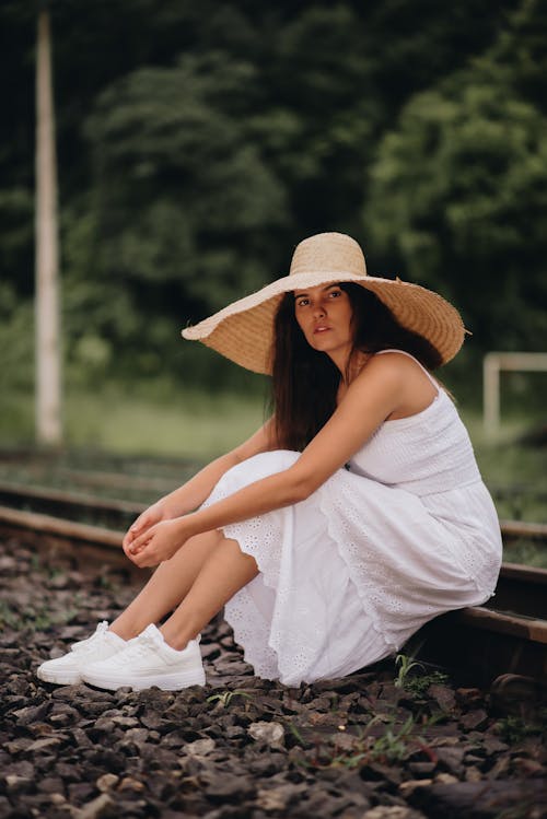 Model in Summer Dress and Straw Hat