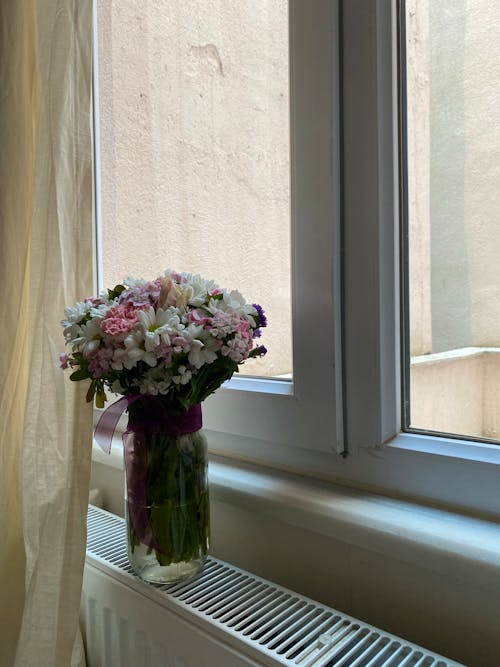 Bouquet in Vase on Radiator