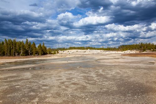 Free Dramatic sky over a dried riverbed at Yellowstone National Park. Stock Photo