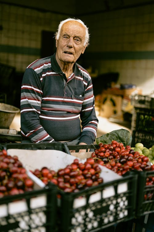 Man Selling Fresh Fruit at a Market 