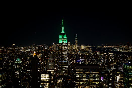 Stunning view of New York City's skyline at night with the illuminated Empire State Building.