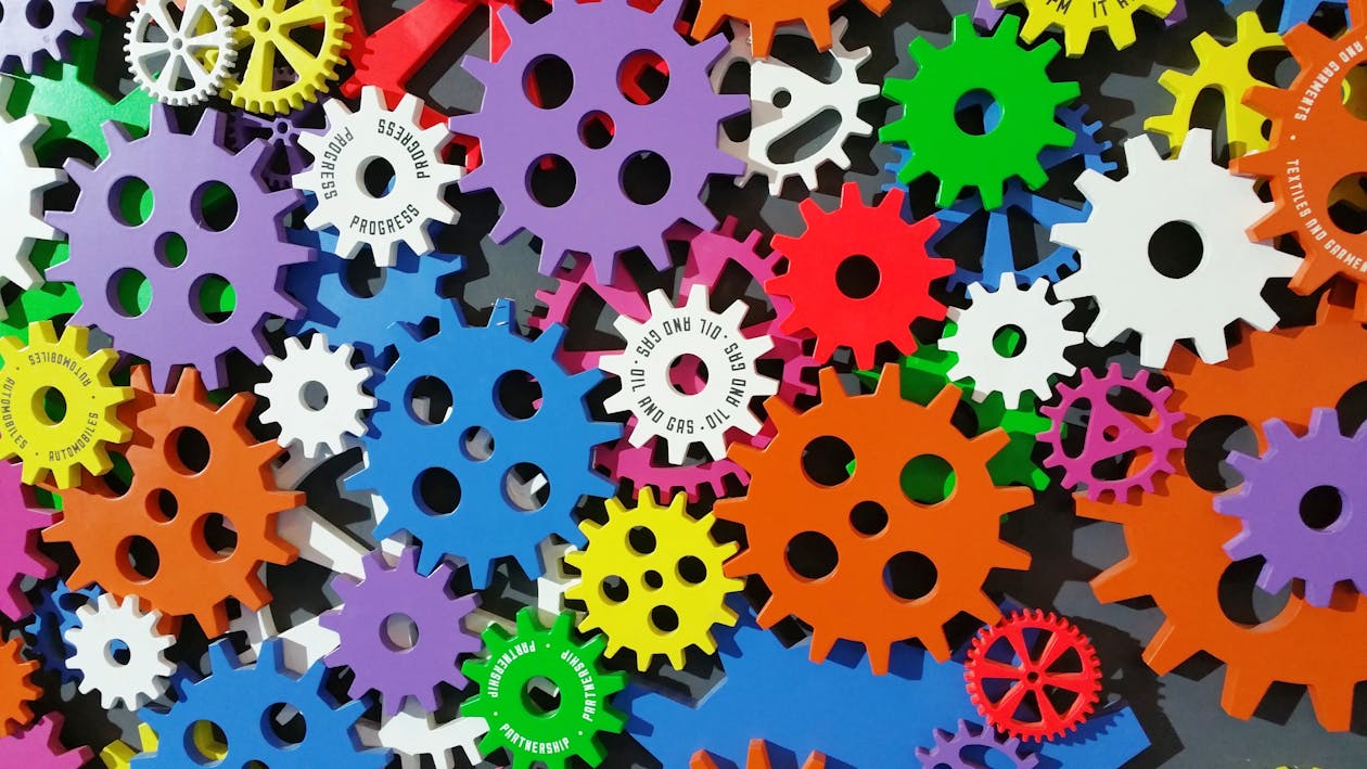 An image of mulicoloured cogs. 
