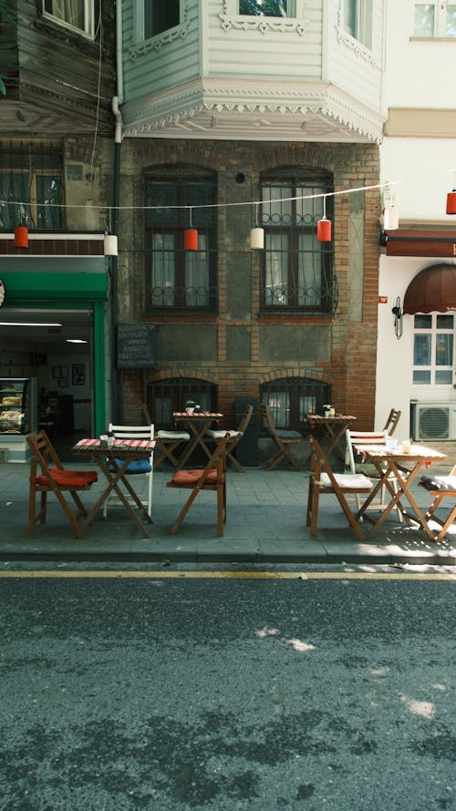 Free Tables and Chairs on the Pavement in front of a Restaurant  Stock Photo