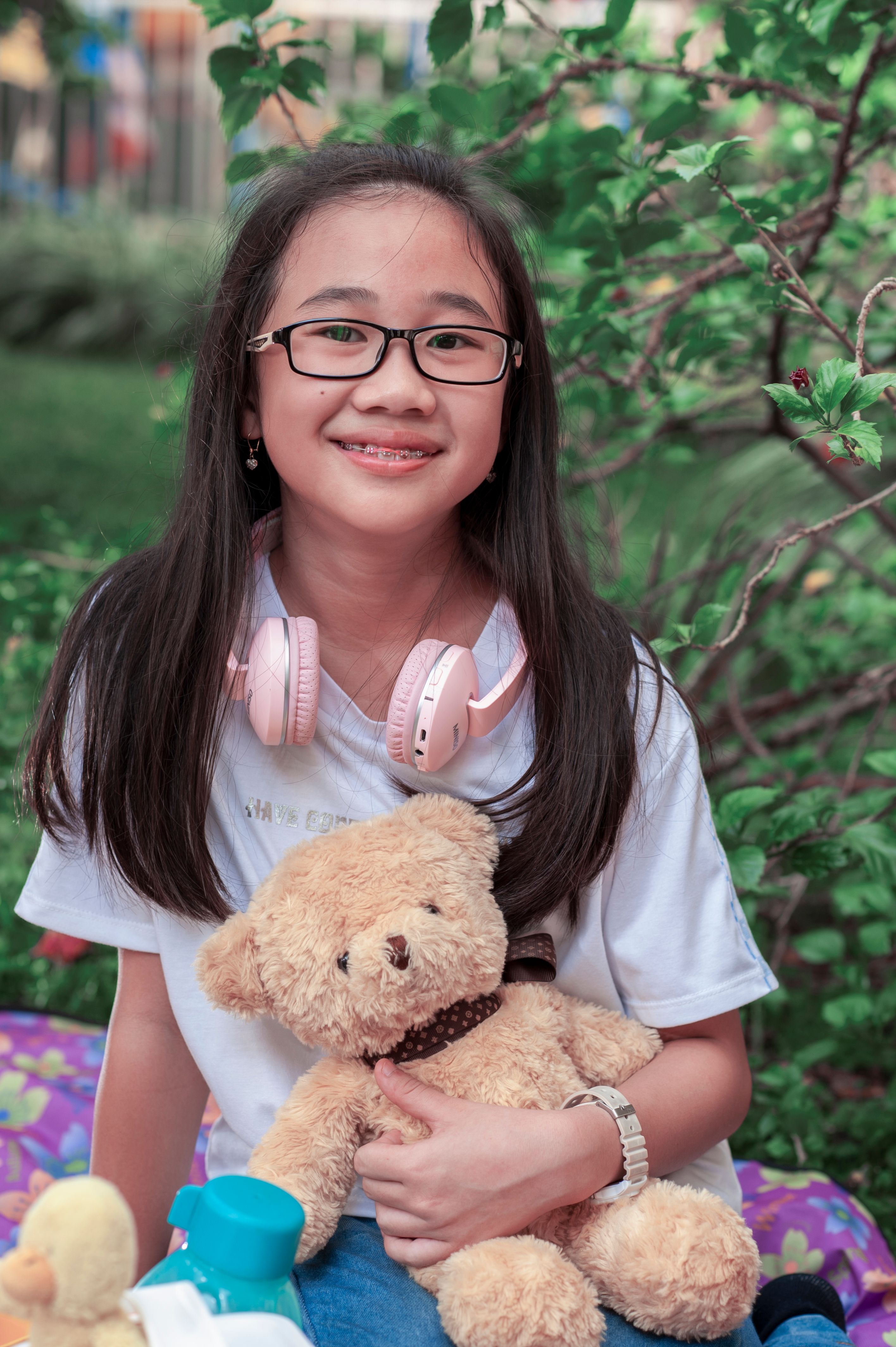 A Girl Sitting with a Teddy Bear · Free Stock Photo