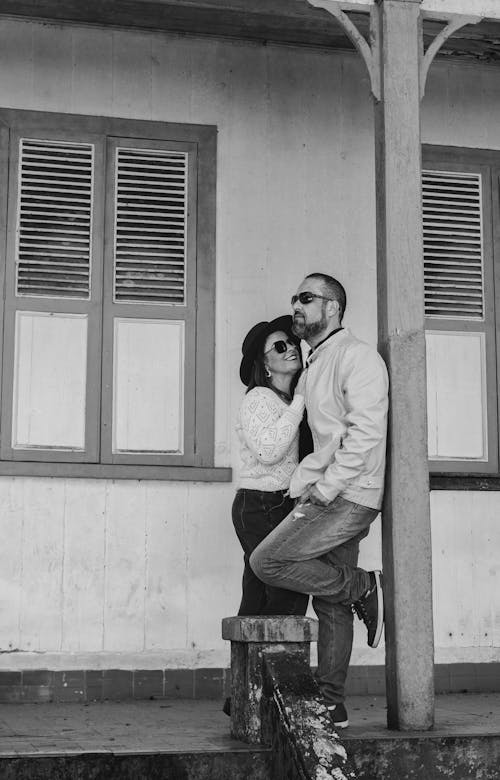 Couple in Front of a House in Black and White