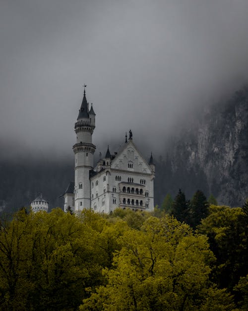 Free Clouds over Castle in Forest Stock Photo