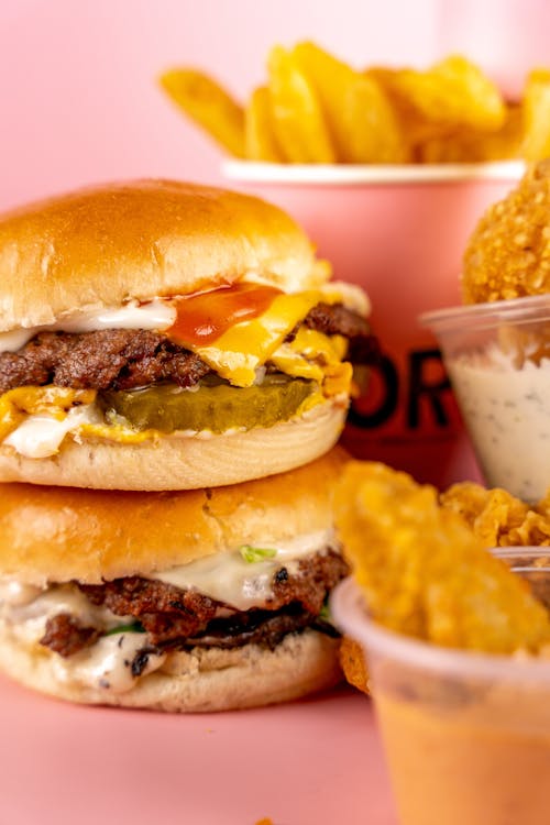 Closeup of Fast Foods against Pink Background