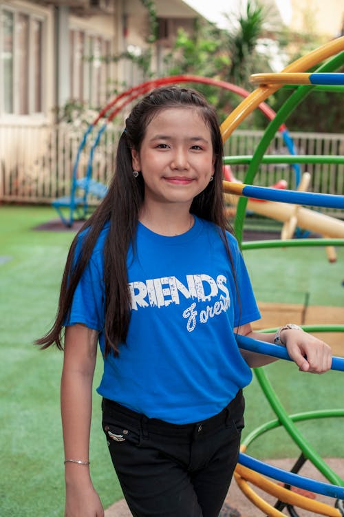 Smiling Girl in Blue T-shirt