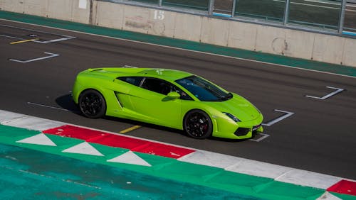 Green Sports Car on Racing Track