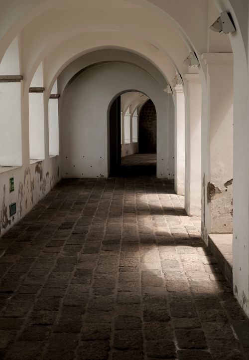 Free Captivating view of ancient arches and walkway in a monastery in Quito, Ecuador. Stock Photo