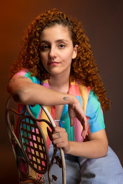 Woman with Curly Hair Sitting