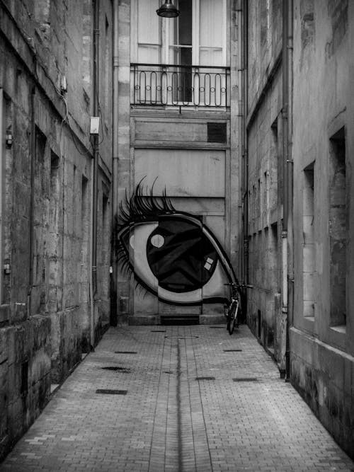 Painting of an Eye on a Wall of a Building in City 