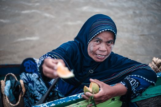 Woman Holding Fruit and Posing