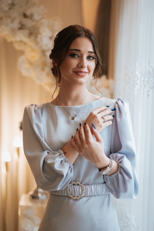 Smiling Woman in White Dress