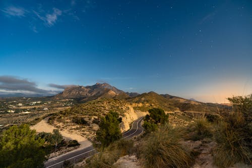 Clear Sky over Road and Hills at Sunset