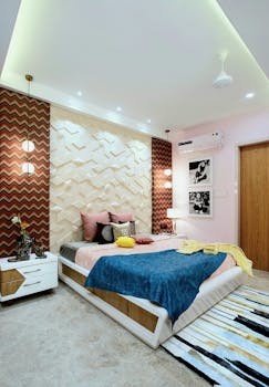 Contemporary bedroom design in Raipur, India with chic decor and stylish lighting.