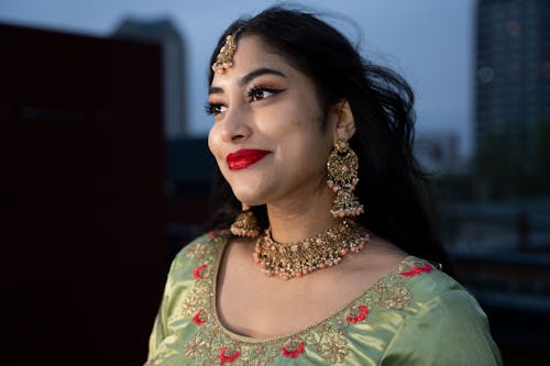 Smiling Woman with Golden Jewelry