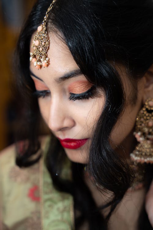 Young Woman in a Glamour Makeup Look and Traditional Jewelry 