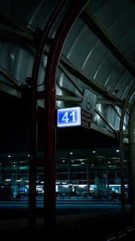 A dimly lit terminal sign '41' at Bursa Airport, Türkiye, captured during nighttime.